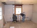 installing insulation and sheet rock